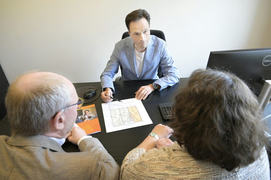 Fair House Buyers consultant reviewing an offer with homeowners