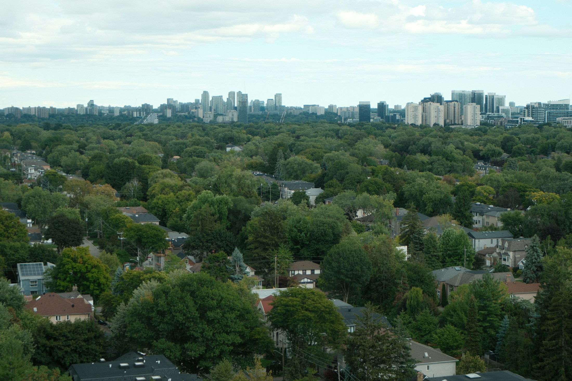 Aerial view of Toronto neighbourhoods and the downtown skyline